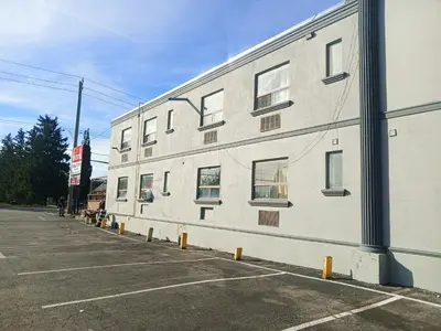 a white building with windows on the side of it at London Residency Inn in London