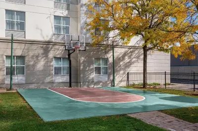 a basketball court in front of a building at Homewood Suites by Hilton Burlington in Burlington