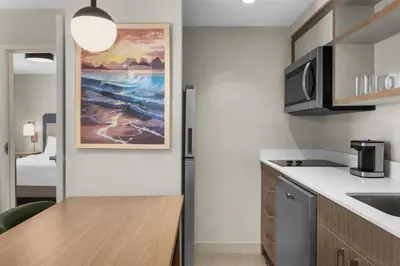 a kitchen with a sink and a counter top at Homewood Suites by Hilton Burlington in Burlington
