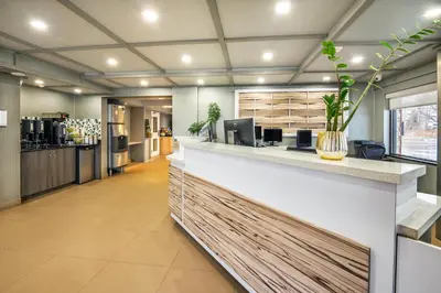 a lobby of a store with a reception counter at Quality Inn in Barrie