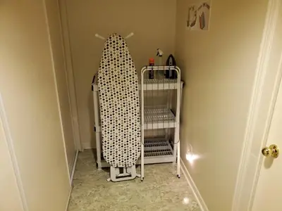 a towel rack in a hallway with a crib at Private Apartment Close to Airport Toronto Pearson in Toronto