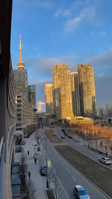 a city with tall buildings and a street with cars at Toronto Downtown Luxurious Stylish 3 Bedroom 3 Bath 2 Balconies near Rogers Centre lakeview condo in Toronto
