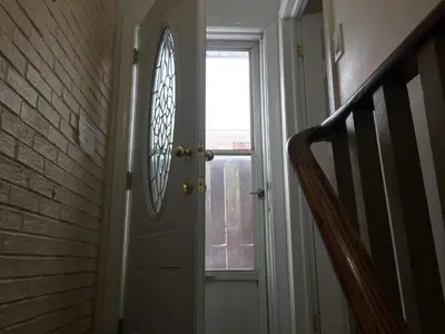 a hallway with a door with a window at Private Room near Airport in Mississauga