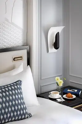 a bedroom with a bed with a tray with food on it at Fairmont Royal York Gold Experience in Toronto