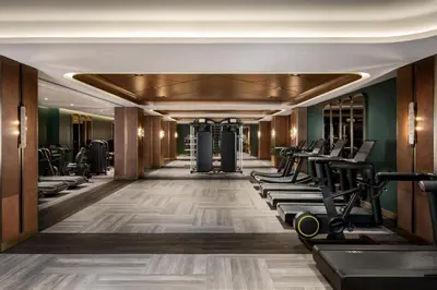 a gym with exercise equipment in a hotel room at Fairmont Royal York Gold Experience in Toronto