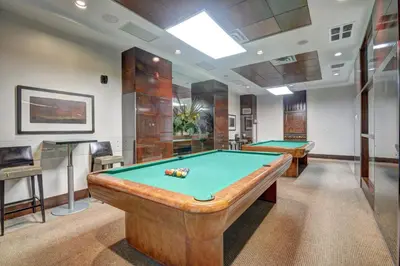 a billiard room with two pool tables in it at Bombay Suites Mississauga in Mississauga