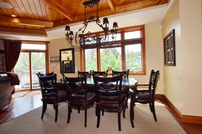 a dining room with a table and chairs at Blue Mountain-Luxurious BlueSki George Chalet, Hot Tub, Pool, Gas Fireplace in Blue Mountains