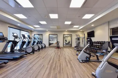a fitness room with treadmills and cardio machines at Staybridge Suites - Waterloo - St. Jacobs Area in Waterloo