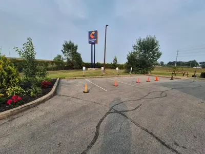 a parking lot with a bunch of orange cones at Comfort Inn in Fort Erie