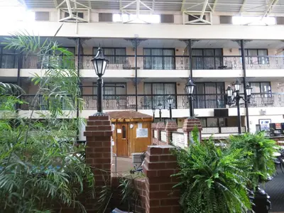 a building with a smallshed in the middle of a courtyard at Clifton Victoria Inn at the Falls in Niagara Falls