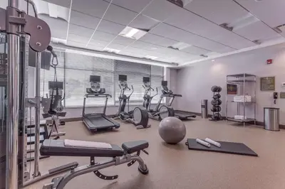a gym with several treadmills and exercise bikes at Hilton Garden Inn Toronto/Brampton West, Ontario, Canada in Brampton