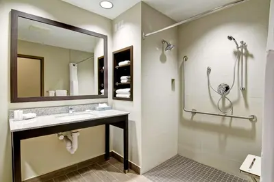a bathroom with a sink and a shower at Best Western London Airport Inn & Suites in London
