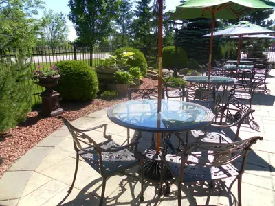 a group of tables and chairs with umbrellas at The Casablanca Hotel in Grimsby