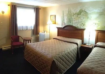 a hotel room with two beds and a window at Majers Motel in Stratford