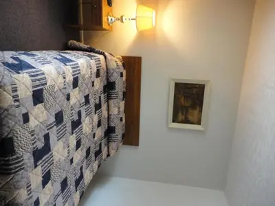 a bedroom with a bed and a painting on the wall at Hipwell's Motel in Fonthill