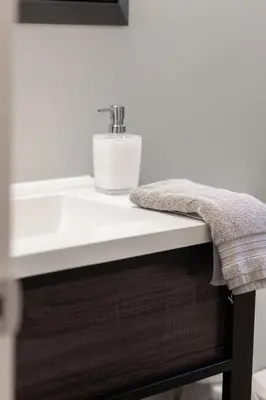 a bathroom counter with a sink and a towel at ENTIRE 2 BEDROOM APARTMENT UPTOWN WATERLOO - e2 in Waterloo