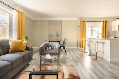 a living room with a couch and a table at ENTIRE 2 BEDROOM APARTMENT DOWNTOWN - u3 in Waterloo