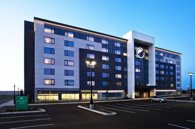 a large building with a clock on it in a parking lot at Element Vaughan Southwest in Vaughan