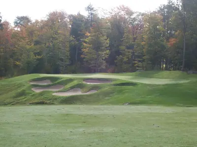 a group of golf courses on a green at Rocky Crest Golf Resort in MacTier
