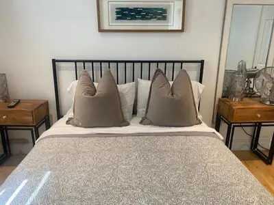 a bedroom with a large bed with pillows on it at Clearbrooke Gem- Bright Private Bedroom close to YYZ in Toronto