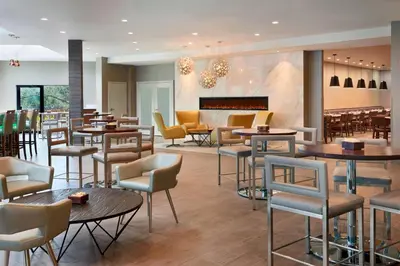 a restaurant with tables and chairs at Element Toronto Airport in Mississauga