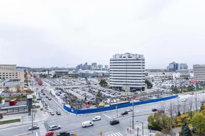 a city with a lot of traffic on a highway at PlanURstay - Luxury 1BR Condo with City View in Mississauga