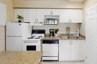 a kitchen with white appliances and a sink at Condo 816 at North Creek Resort in Blue Mountains