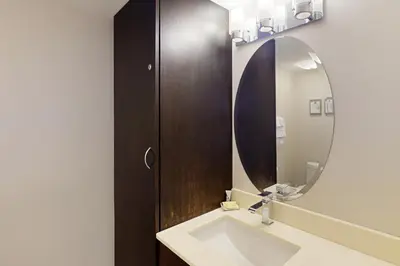 a bathroom with a sink and a mirror at Wintergreen 202 in Blue Mountains