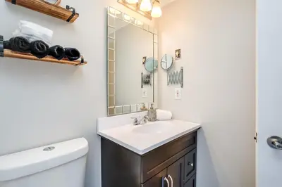 a bathroom with a sink and a mirror at Mountainside Resort Condo at Blue in Blue Mountains