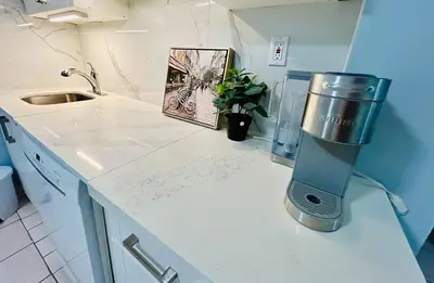 a blender sitting on a counter in a kitchen at Cozy basement room-Private Bath - Near Subway line 1 - Toronto in Toronto