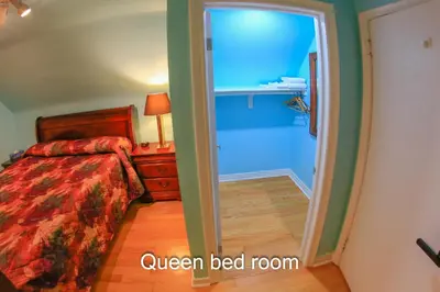a bedroom with a bed and a door leading into a room at Comfort Home Toronto in Toronto