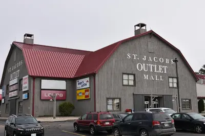 a building with cars parked in a parking lot at Hammer Haus II in Waterloo