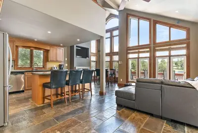 a kitchen and living room with a couch and a table at Kawartha Lakes, Fenelon Falls in Fenelon Falls