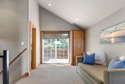 a living room with a couch and a sliding glass door at Kawartha Lakes, Fenelon Falls in Fenelon Falls