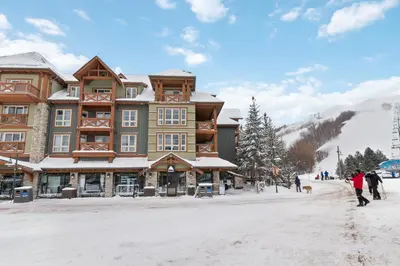 a building on a ski slope in the snow at 2 BR Ski In Out at Cachet Crossing, Sleeps 8 in Blue Mountains