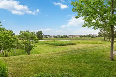 a park with green grass and trees on a sunny day at 2 Bdrm Ski In Ski Out Loft at Blue Mountain in Blue Mountains