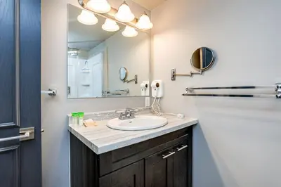 a bathroom with a sink and a mirror at 2 Bdrm Ski In Ski Out Loft at Blue Mountain in Blue Mountains