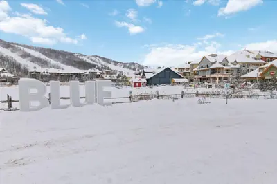 a resort in the snow with the word blizzard at 2 Bdrm Ski In Ski Out Loft at Blue Mountain in Blue Mountains