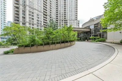 a walkway in a city with tall buildings at PlanURstay - Ideal 2 BR & 2BTH 3888 Duke of York Blvd in Mississauga