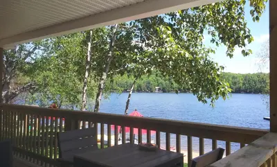 a view of a lake from the porch of a house at Ogopogo Resort in Carnarvon