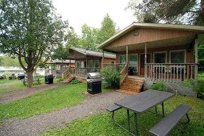 a house with a picnic table in front of it at Ogopogo Resort in Carnarvon