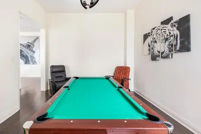 a green pool table in a room with art at Grand Waterfront Retreat under 1hr from Toronto in Bowmanville