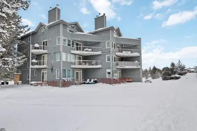 a large apartment building in the snow at Condo at Blue Mountain on Ski Run Close to Village in Blue Mountains