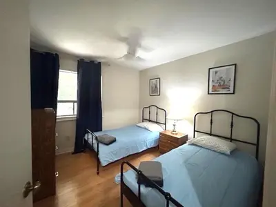 a bedroom with two beds and a window at Leslie in Wasaga Beach