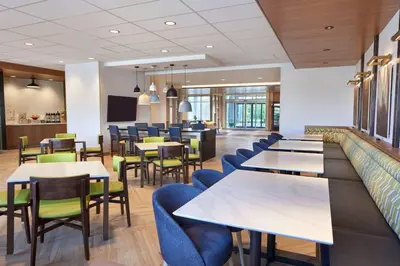 a dining room with tables and chairs at Fairfield by Marriott Inn & Suites Orillia in Orillia