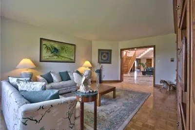a living room with a couch and a table at Grand Villa Estate in Burlington