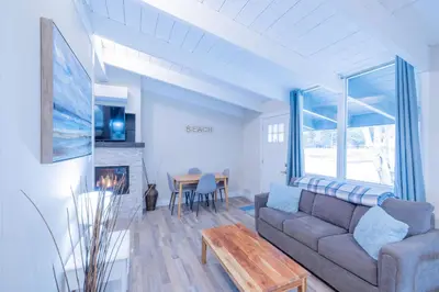 a living room with a couch and a table at Boutique Suite #3 in Blue Mountains