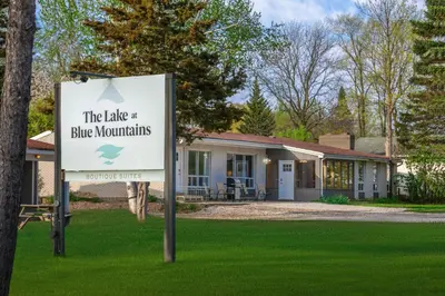 a sign in front of a blue mountains home at Boutique Suite #5 in Blue Mountains
