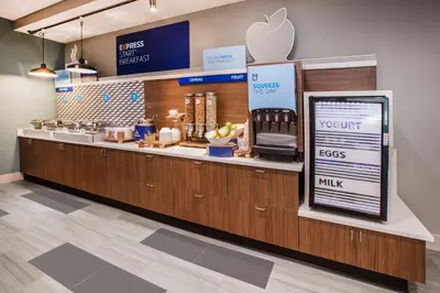 an apple store with a counter with an appleasteryasteryasteryasteryasteryasteryastery at Holiday Inn Express & Suites - Welland in Welland