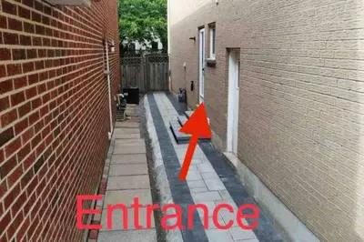 an image of an alley with an orange arrow at 3 Spacious Bedroom Basement Apartment in Richmond Hill in Richmond Hill
